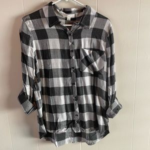 NWOT. Never worn plaid button up shirt. Size medium.